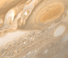 The Great Red Spot (upper right) is wide enough to swallow two Earths.